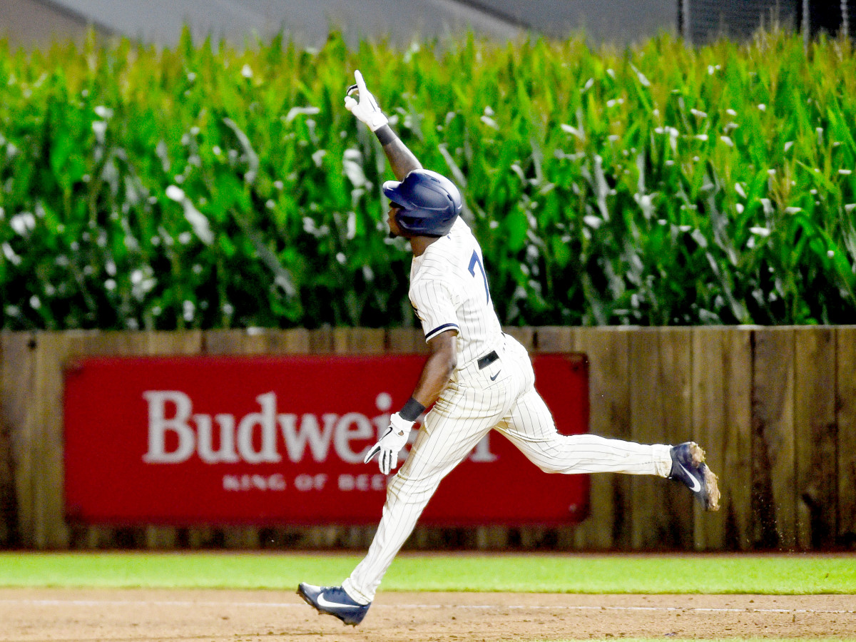 Aug 12, 2021; Dyersville, Iowa, USA; Chicago White Sox shortstop Tim Anderson (7) reacts after hitting a two-run home run in the ninth inning to defeat the New York Yankees at Field of Dreams.